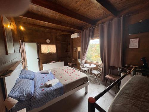 a small bedroom with a bed and a window at Le Dimore Del Sarto Polignano a mare in Polignano a Mare