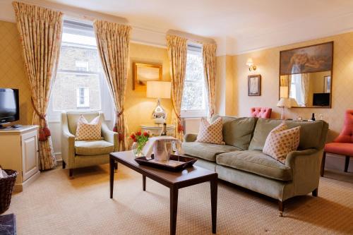 a living room with a couch and a table at Durrants Hotel in London