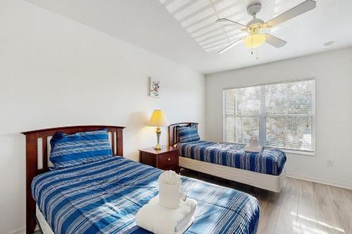 En eller flere senge i et værelse på Coconut Bungalow #103