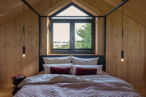 Ένα ή περισσότερα κρεβάτια σε δωμάτιο στο Holi Huus A