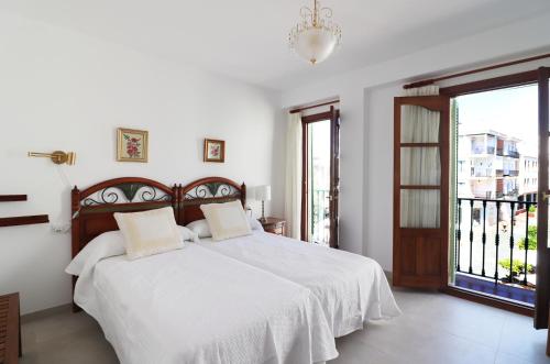 En eller flere senge i et værelse på Casa Miramar Spainsunrentals