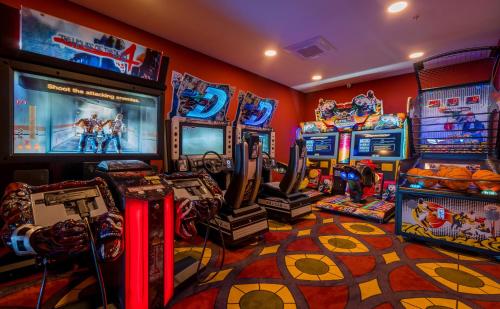 a room with arcade games and video games at Litz Resort in Kvariati