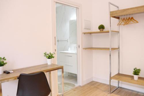 an office with a desk and a chair in a room at lullaby by hamilton in Barcelona