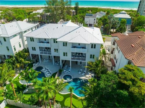 an aerial view of a large house with a swimming pool at Gulfside Green Estate in Siesta Key