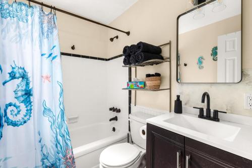 Ένα μπάνιο στο Walk 2 Beach Corporate Families Pets OK