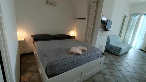 Ένα ή περισσότερα κρεβάτια σε δωμάτιο στο Sea Garden - San Bartolomeo al Mare