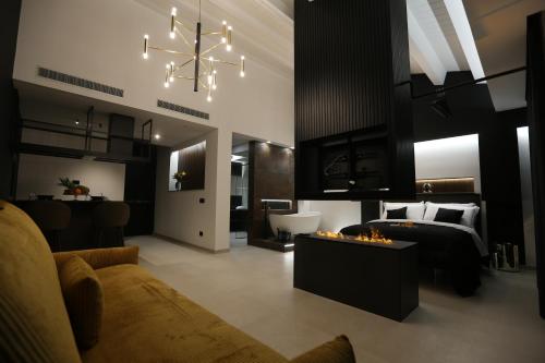 a bedroom with a bed and a chandelier at B&B Il Moro Luxury Rooms in Syracuse
