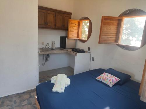 Postel nebo postele na pokoji v ubytování Hotel Quinto Sol