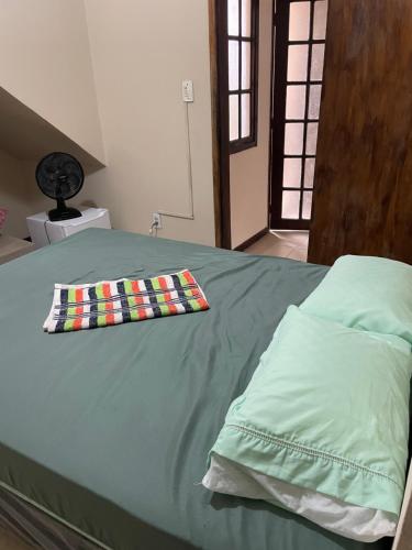 En eller flere senge i et værelse på Quartos Privativos Stella Maris