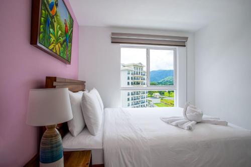 Ένα ή περισσότερα κρεβάτια σε δωμάτιο στο Viva Jaco Viva Jaco (10-03B)