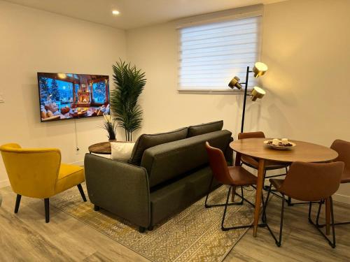 a living room with a couch and a table at Cute & Cozy Hub for Montreal Travelers in Montréal