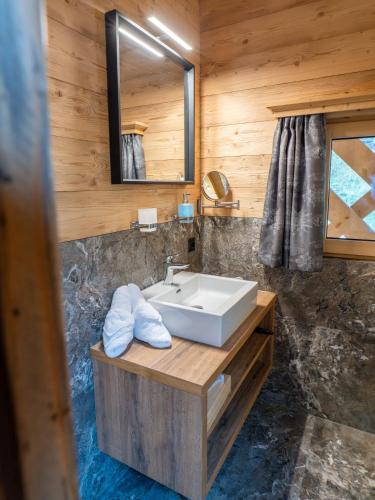 a bathroom with a sink and a mirror at Alte Mühle in Nauders