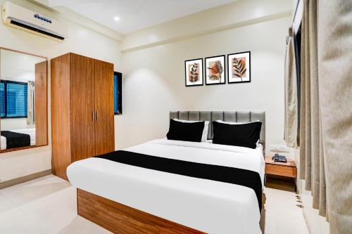 Ένα ή περισσότερα κρεβάτια σε δωμάτιο στο Hotel O Sai Palace