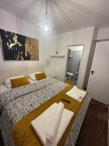 En eller flere senge i et værelse på Apart Lisbon Airport