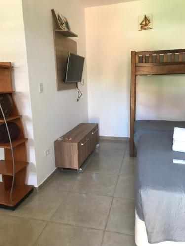 TV a/nebo společenská místnost v ubytování Apart Hotel Guaiuba