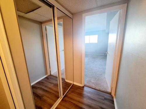 an empty room with a mirror and a hallway at Long term 1BR w Balcony & Parking Near Philly in Jenkintown