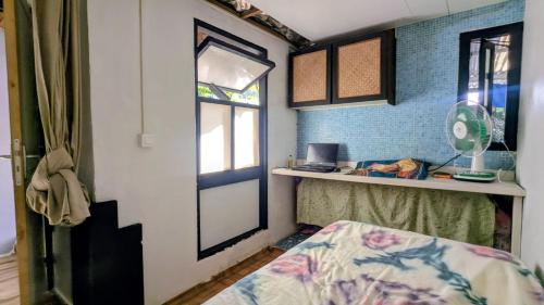 Ένα ή περισσότερα κρεβάτια σε δωμάτιο στο Chez Hinano SIKI