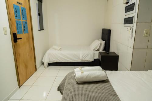 Postel nebo postele na pokoji v ubytování 2 habitaciones con baño privado y cocina equipada en el centro de Asunción