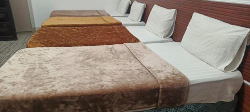 Giường trong phòng chung tại نزل التقوى