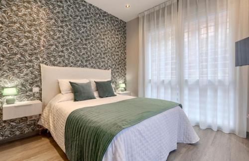 Ένα ή περισσότερα κρεβάτια σε δωμάτιο στο Madrid Apt 4 rooms 4 bathrooms