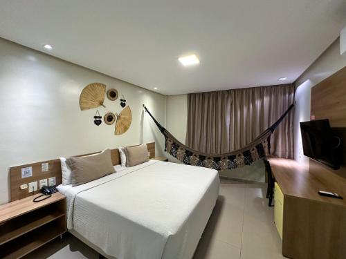 Postel nebo postele na pokoji v ubytování Hotel Palace Santarém Brasil