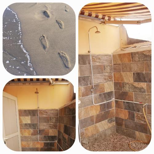 a bathroom with a shower with footprints in the tiles at La Case Saint-Pierre in Saint-Pierre