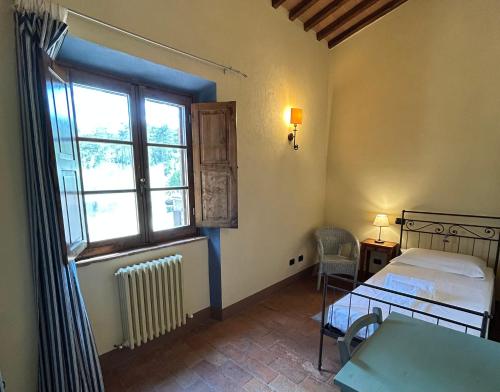 Giường trong phòng chung tại Podere Casanova - Gilvus Relax in San Gimignano