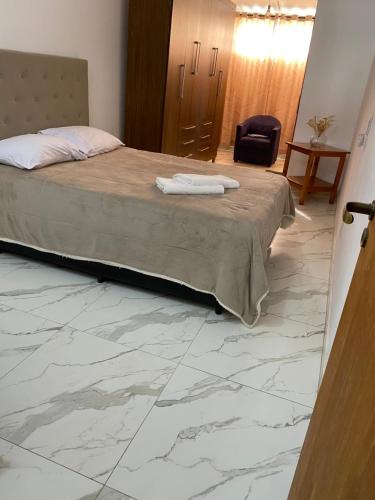 Кровать или кровати в номере Kitnet Centro da Cidade