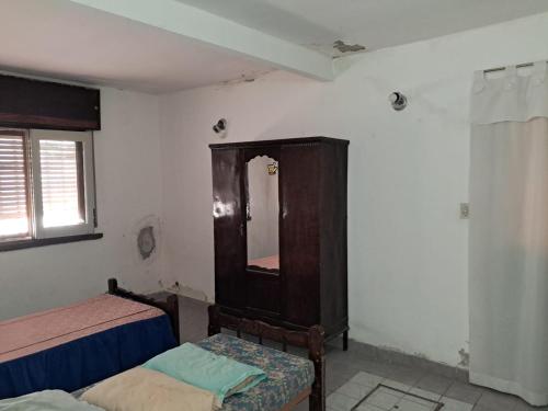 Postel nebo postele na pokoji v ubytování Cosquin centro con 2 cocheras