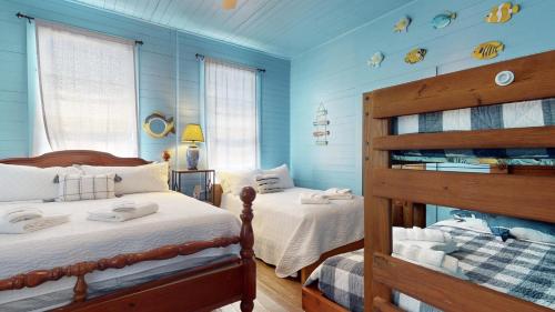 En eller flere senge i et værelse på Shiloh by the Sea