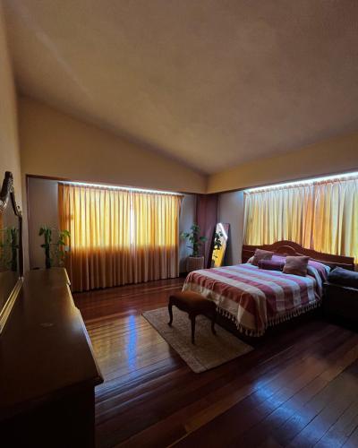 Ένα ή περισσότερα κρεβάτια σε δωμάτιο στο Casa Carmesí