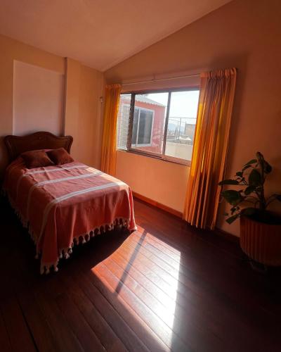 Ένα ή περισσότερα κρεβάτια σε δωμάτιο στο Casa Carmesí