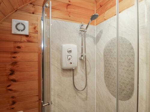 a shower in a bathroom with a glass door at Rowan in Ulverston