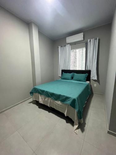 Ένα ή περισσότερα κρεβάτια σε δωμάτιο στο AP Quatro Estações