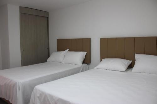 Ένα ή περισσότερα κρεβάτια σε δωμάτιο στο Hotel Ces