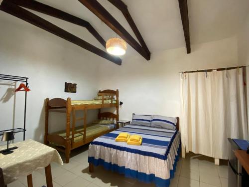 Postel nebo postele na pokoji v ubytování Landhaus Samaipata