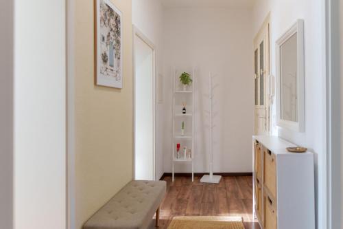 a living room with a bench and a table at Gemütliche 2-Raum-Wohnung in Leipzig