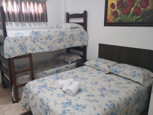 Кровать или кровати в номере Kitnet no interior de São Paulo 25