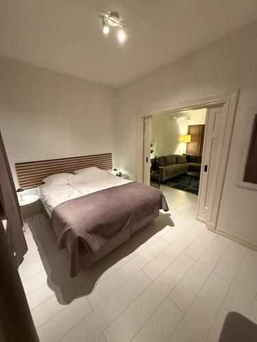 a bedroom with a bed and a living room at 't Zusje in Enschede