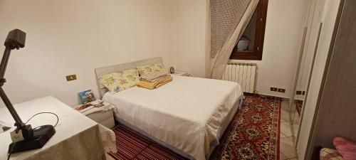 En eller flere senge i et værelse på Villa Polesine