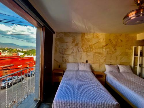 En eller flere senge i et værelse på LA ESTANCIA, Casa EA Oaxaca, Centro Histórico, Balcón a las Montañas