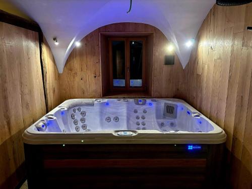 a bathroom with a jacuzzi tub in a room at Chalet du cerf fragment in Saint-Martin-de-Belleville