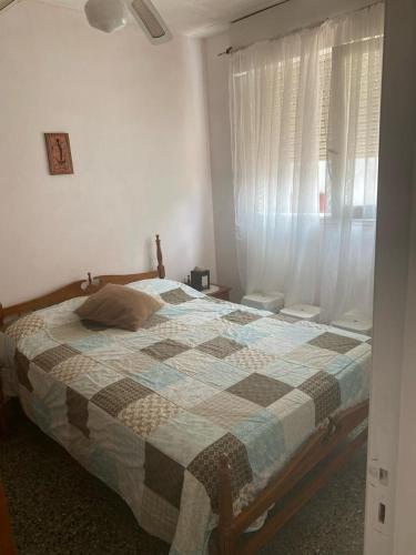 En eller flere senge i et værelse på Depto Santa Teresita Juanita