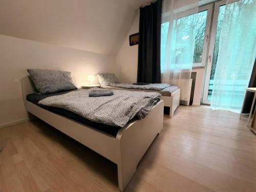 Ένα ή περισσότερα κρεβάτια σε δωμάτιο στο Apartment Am Hang II Natur & Ruhe