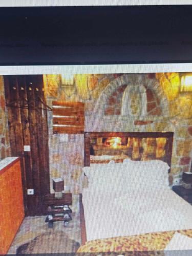 Ένα ή περισσότερα κρεβάτια σε δωμάτιο στο Αίγλη Καλάβρυτα