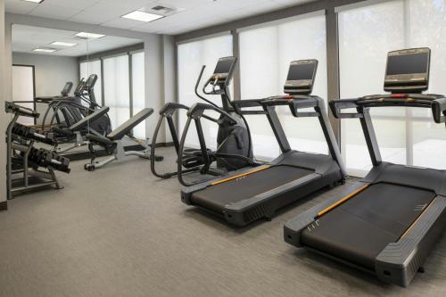 a gym with several treadmills and elliptical machines at Courtyard Carson City in Carson City