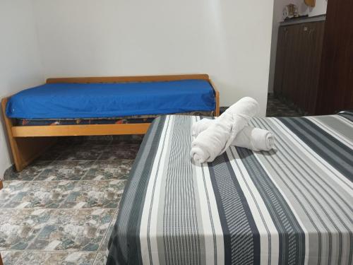 Postel nebo postele na pokoji v ubytování Aconxeguinho