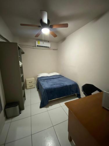 a bedroom with a bed and a ceiling fan at Habitacion C10 privada centro monterrey in Monterrey