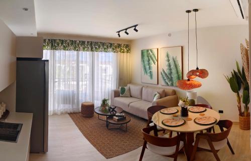 a living room with a couch and a table at Green Oasis in La Laguna