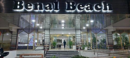 a man walking into a building with a sign on it at Benal Beach Vibe in Benalmádena